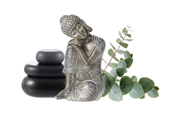 Old silver color statuette sleeping Buddha with black zen stones and eucalyptus twigs isolated on white background.