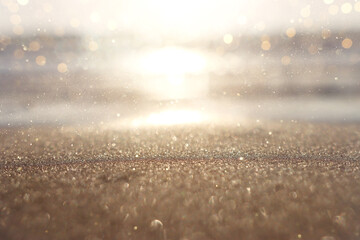 Sea waves and warm sunset light, calm and relaxing sandy beach