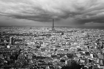 View from Sacre Coeur over Paris with Eiffel Tower in Center and rain clouds in background
