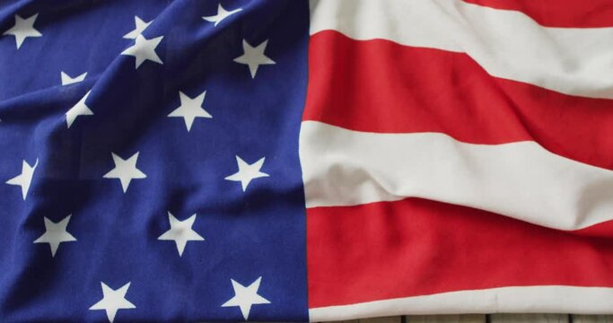 Video of flag of usa lying on wooden background