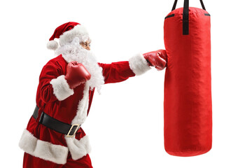Santa claus boxing a punching bag