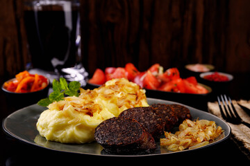 Fried homemade sausage, mashed potatoes with fried onions. Homemade food.