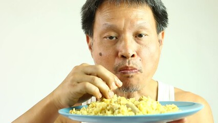 Man is scooping Biryani  rice by hand in studio Chiangmai Thailand