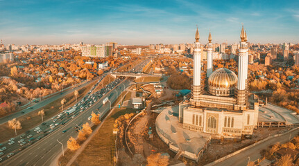 Fototapeta na wymiar Aerial view of islamic mosque near a busy highway in Ufa. Sights and popular cities of Russia.