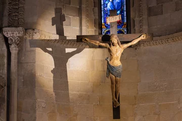 Poster MATERA, ITALY - MARCH 7, 2022: The carved polychrome Crucifixion statue in the presbytery of church Chiesa di San Giovanni Battista by unknown artist. © Renáta Sedmáková