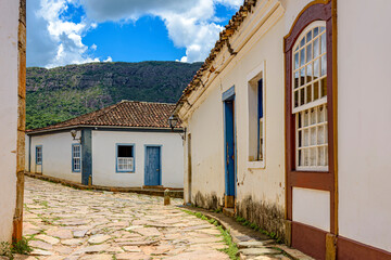 Fototapeta na wymiar Old town street with historic colonial style houses in the city of Tiradentes in the interior of the state of Minas Gerais, Brazil