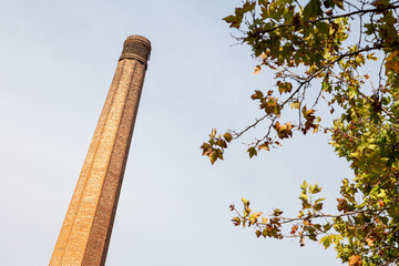 old disabled brick chimney of a cheese factory
