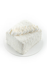 cake with coconut flakes on white background