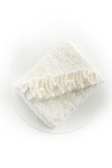 cake with coconut flakes on white background