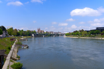 Scenic landscape with Rhine River at City of Basel on a blue cloudy spring day. Photo taken April 27th, 2022, Basel, Switzerland.