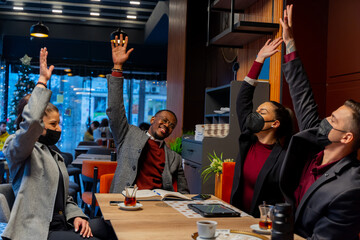 Being happy with their hands up