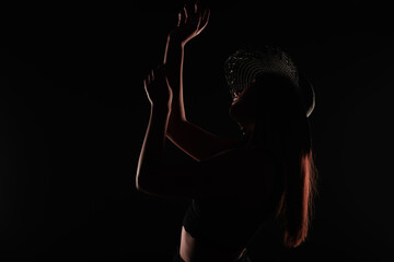 Posing and being seductive in studio, silhouette close up