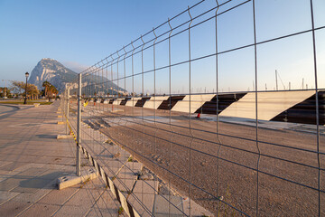 view of the border fence separating the Spanish town of La Linea de la Concepcion from the British colony 