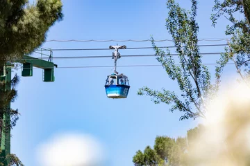 Fotobehang Cableway. Cable car in Madrid that connects the Parque del Oeste with the Casa de Campo in Madrid. Clear day with a blue sky, in Spain. Europe. Photography. © Fernando Astasio