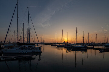 Fototapeta na wymiar ships moored in the port of la linea de la concepcion in front of gibraltar at sunset
