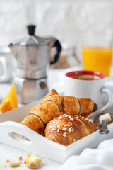 Good morning breakfast concept with croissants, espresso coffee and fresh orange juice