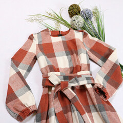 red plaid dress autumn clothes on a white background. stylish women's outfit