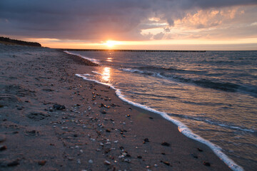 Sunset on the Baltic Sea. Sea, bean strong colors. Vacation on the beach. Landscape