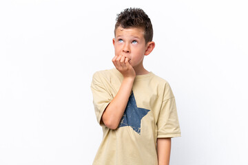 Little caucasian boy isolated on white background is a little bit nervous