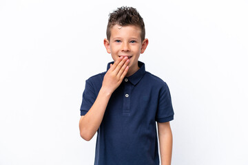 Little caucasian boy isolated on white background happy and smiling covering mouth with hand