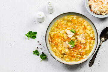 Healthy fermented cabbage soup in plate. Top view, copy space, flat lay.