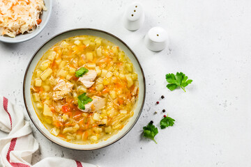 Healthy fermented cabbage soup in plate. Top view, copy space, flat lay.