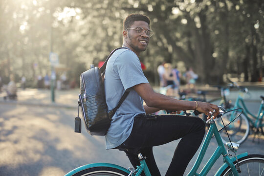 young man on a bicycle in a park