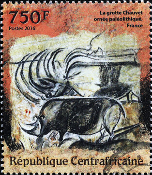 Prehistoric depictions of rhinos on postage stamp
