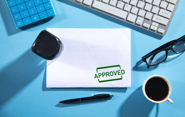 Document with approved stamp and business objects.