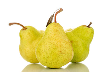Three juicy bright yellow pears, close-up, isolated on a white background.