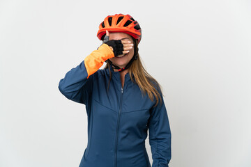 Middle age cyclist woman isolated on white background covering eyes by hands. Do not want to see something