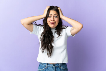 Young caucasian woman isolated on purple background doing nervous gesture