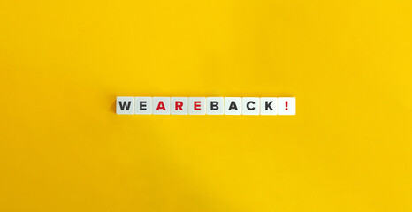 We Are Back Exclamation and Banner. Letter Tiles on Yellow Background. Minimal Aesthetics.