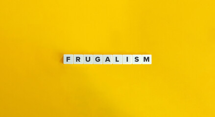 Frugalism Word and Banner. Letter Tiles on Yellow Background. Minimal Aesthetics.