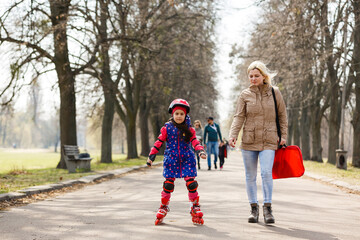 Young happy skater trying exciting outdoor activity.