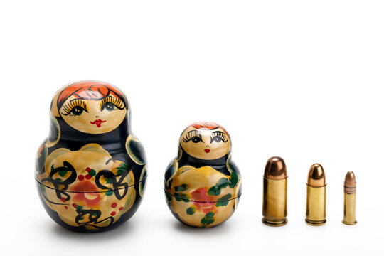 Russia dolls and many gun bullets on white background , Stop the war concept