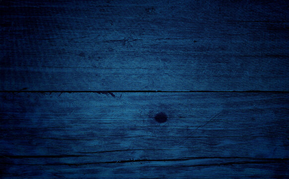 old blue wood texture background. close up blue wooden table showing rough wood grain and wood pith. old plank lumber wood. colorful wooden background grunge.