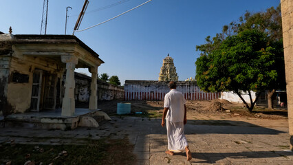 Fototapeta na wymiar Pilgrim walking towards to small temple 