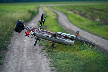 Mountain bike lies on a rural road