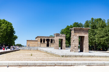 Fototapeta na wymiar Temple of Debod. Surroundings of Temple of Debod in Madrid on a clear day with blue sky, in Spain. Green gardens with splendid flowering plants and shrubs in the spring. Europe. Photography.