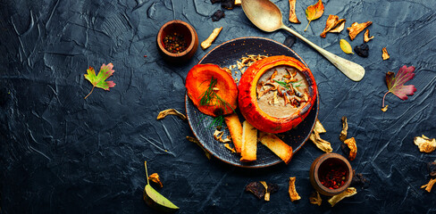 Mushroom soup in pumpkin,copy space