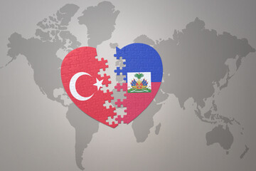 puzzle heart with the national flag of turkey and haiti on a world map background. Concept.