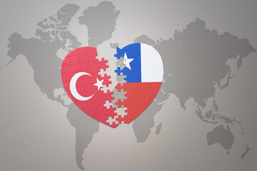 puzzle heart with the national flag of turkey and chile on a world map background. Concept.