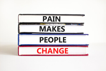 Pain makes people change symbol. Concept words Pain makes people change on books on a beautiful white table white background. Business, motivational and pain makes people change concept.