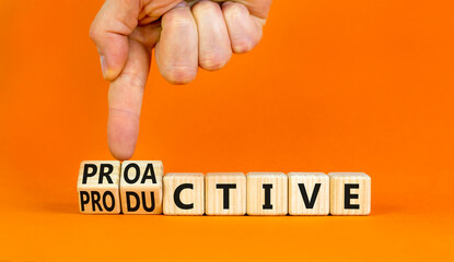 Proactive and productive symbol. Businessman turns cubes and changes the concept word Productive to Proactive. Beautiful orange background. Business proactive and productive concept. Copy space.