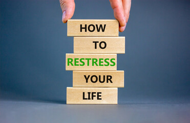 Restress your life symbol. Concept words How to restress your life on wooden blocks. Doctor hand. Beautiful grey background. Psychological business and restress your life concept. Copy space.