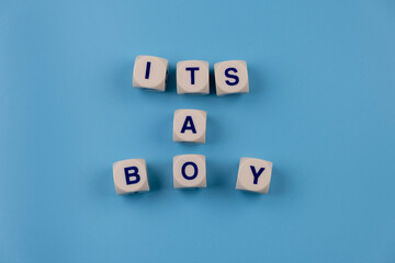  blue background with text - it's a boy. concept for celebrating a newborn boy's birthday or a party.