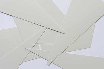 gray paper shapes on a light background