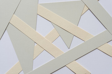 gray and ivory paper shapes on a light background