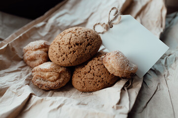 Bakery products with card for logo. Homemade cookies with sugar on a paper background. Background image, copy space.